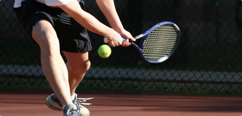 Playing tennis